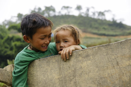 Sapa, Vietnam - August 10, 2018: Children from villages in the mountainous area of ââSapa, north of Vietnam, expecting to see Western tourists.のeditorial素材
