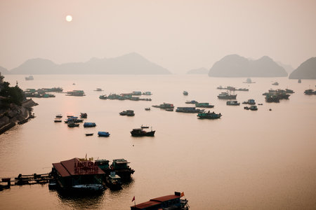 Halong bay, Vietnam - May 11, 2013: Typical wooden boats for tourists sailing through the Cat Ba area, in Ha Long Bay.のeditorial素材