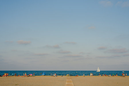 Valencia, Spain - August 8, 2018: Hot beach day in Canet de Emberenguer, Valencia, with bathers basking in the summer sun.のeditorial素材