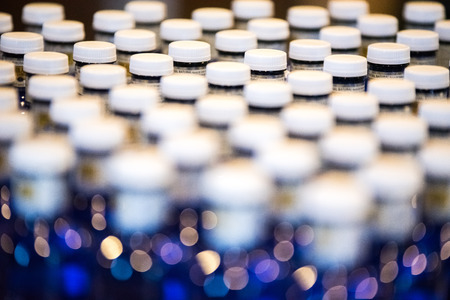 Bottles of water in the delivery of diplomas in the graduation and reception end of course of the college of economists of the Valencian community.の写真素材