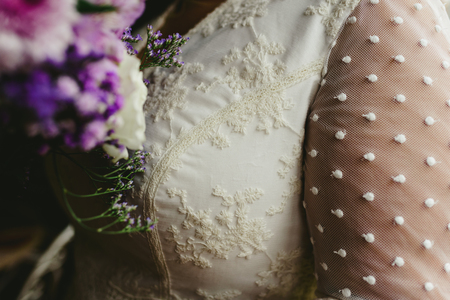 Detail of the wedding dress and its bouquet.の写真素材