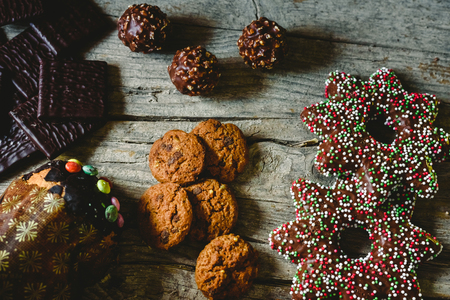 Chocolate cookies, gingerbread cookies and dark chocolate with mint for christmas cream, holiday concept.の写真素材