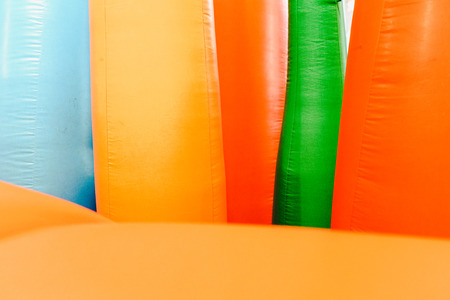 Detail of inflatable castles with shapes of flames of giant colorsの写真素材