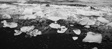 Giant ice blocks detached from icebergs on the coast of an Icelandic beach.