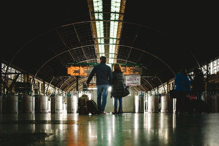 Valencia, Spain - January 20, 2019: Passengers at the train station waiting with their luggage...