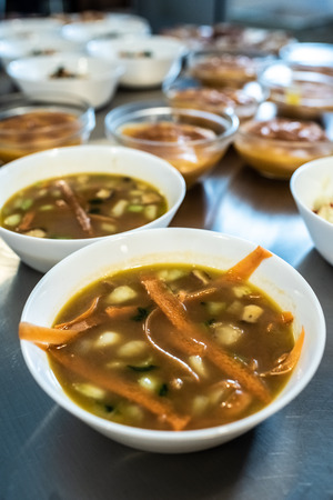 Hot bowls with vegan carrot soup.の写真素材