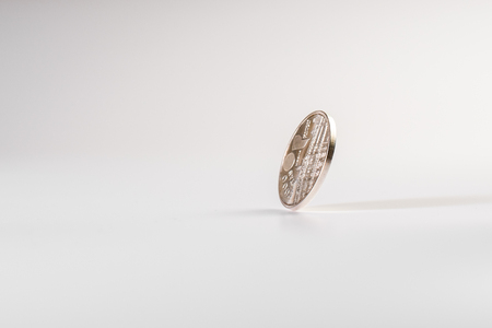 Currency rotating on white background, concept of American economy.の写真素材