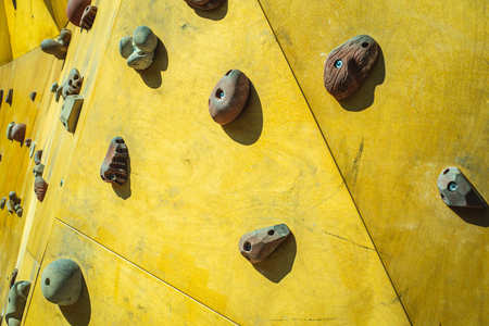 Detail of the wall of an outdoor climbing wall to practice climbingの写真素材