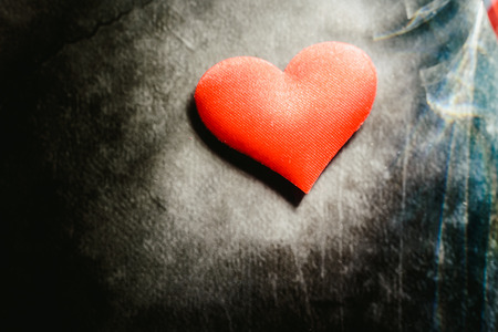 Red hearts isolated on dark background, concept of cardiovascular health or for Valentines.の写真素材