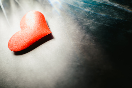 Red hearts isolated on dark background, concept of cardiovascular health or for Valentines.の写真素材