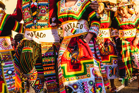 Valencia, Spain - February 16, 2019: Detail of the colorful traditional Bolivian party outfit during a carnival parade showing folklore typical of Latin countries with dancing dancers.のeditorial素材