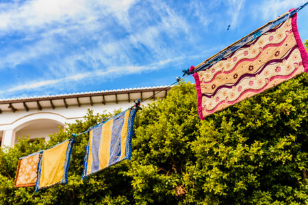 Valencia, Spain - January 27, 2019: Medieval banners hanging between streets at an open-air festival.のeditorial素材