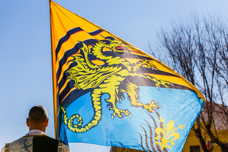 Traditional Italian dance of the flag-wavers Sbandieratori doing stunts throwing their colorful flags in the air, during a festival of tourist trips.の写真素材