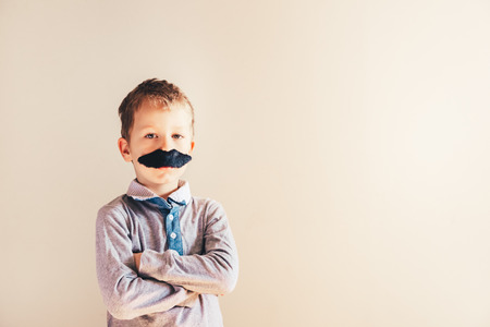 Child with mustache isolated on white.の写真素材