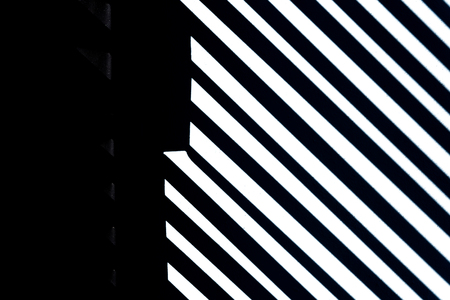 Lines and white stripes on black background with stone texture, copy space.の写真素材