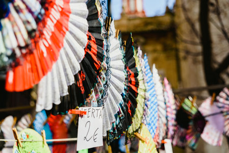 Valencia, Spain - February 24, 2019: Typical colorful Spanish flamenco fans for sale in a street market in spring.のeditorial素材