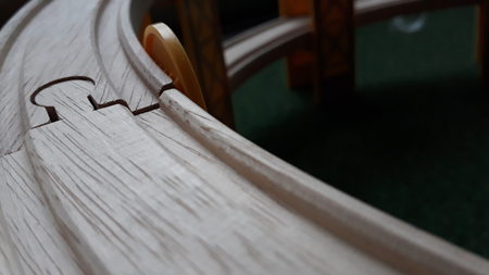 Rails of a wooden game creating a labyrinth of confusion.