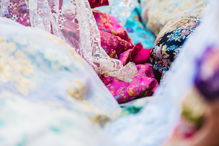 Detail of the traditional Spanish Valencian Fallera dress, colorful fabrics with intricate embroidery.の写真素材