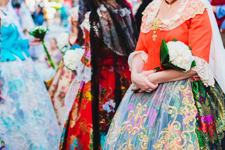 Detail of the traditional Spanish Valencian Fallera dress, colorful fabrics with intricate embroidery.の写真素材