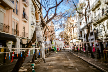 Valencia, Spain - March 19, 2019: Aspect of a downtown street where a Mascleta has been set up, full of firecrackers and fireworks, before its launch.のeditorial素材
