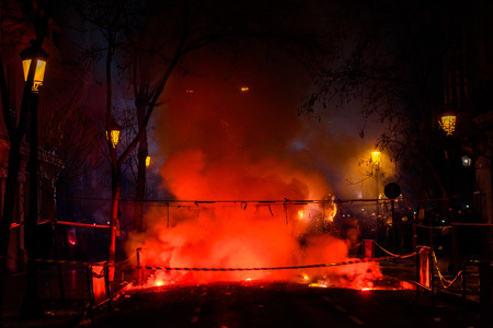 Colorful mascleta full of firecrackers and fireworks with lots of smoke and sparks.