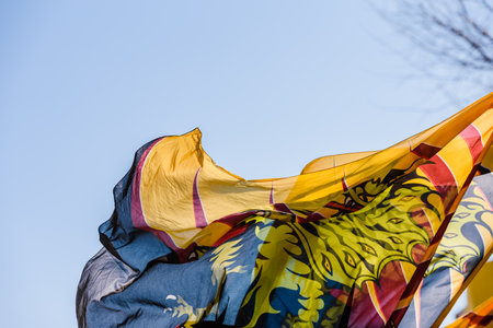 Traditional Italian dance of the flag-wavers Sbandieratori doing stunts throwing their colorful flags in the air, during a festival of tourist trips.のeditorial素材