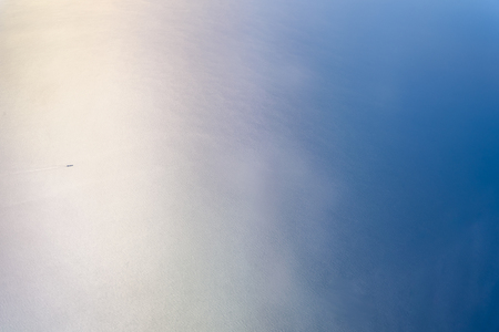 View of the sea from the window of an airplane.の写真素材