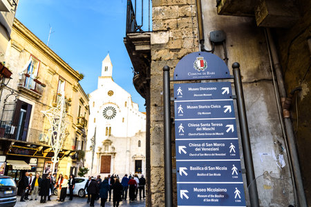 Bari, Italy - March 8, 2019: Entrance to the Cathedral Square Basilica of San Sabino de Bari with information cartels for tourists.のeditorial素材