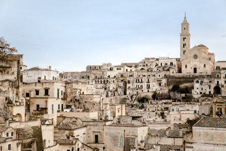 Panoramic view of the city of Matera in Italy, ancient curious village for tourists to be built inside the rocks in caves and stone houses, seen from the top.のeditorial素材