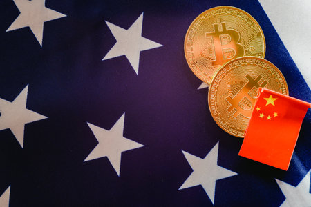 China uses bitcoins to win trade war to the United States, Chinese and American flags together.のeditorial素材