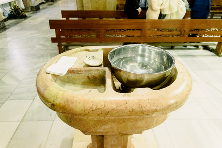 Baptismal font in a catholic church.の写真素材