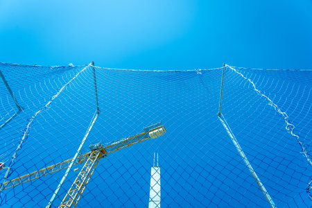 Valencia, Spain - March 30, 2019: Protection net in a masonry worksite in the construction of the...