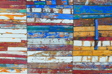 Painted wooden boards of various colors aged, natural texture background.の写真素材