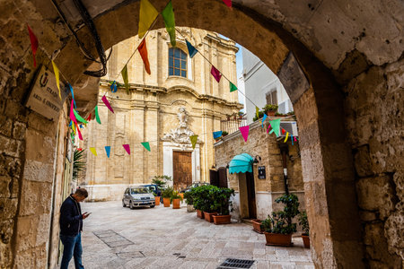 Bari, Italy - March 12, 2019: People walking through the alleys of the old city of Bari.のeditorial素材