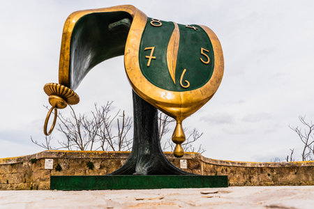Matera, Italy - March 12, 2019: Sculpture DalÃ­'s melted clock displayed on the street on the occasion of the cultural capital of the city.のeditorial素材