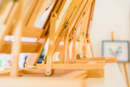 Wooden painter easels in an art class.の写真素材