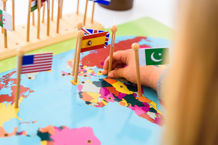 Geography exercise for children, place flags of countries on a map, flag of Spain.の写真素材