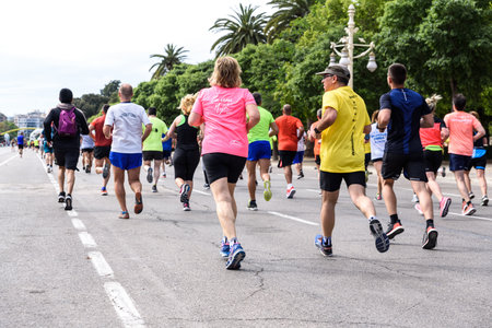 Valencia, Spain - May 19, 2019: Group of runners participating in a popular race.のeditorial素材