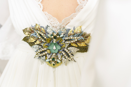 Flower shaped brooch made with small gemstones for a wedding dress.の写真素材