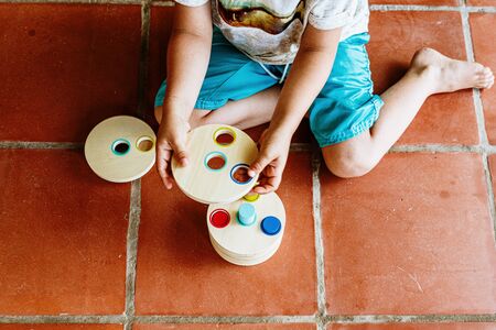 A material of montessori pedagogy, a new style of teaching children in schools around the world, with wooden educational toys.の写真素材