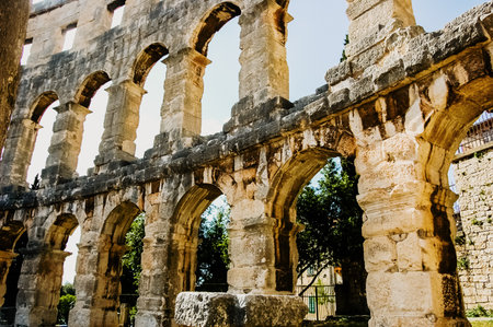 Pula, Croatia - June 10, 2019: Roman amphitheater in Pula, the best preserved ancient monument in Croatia, visited by hundreds of tourists.のeditorial素材