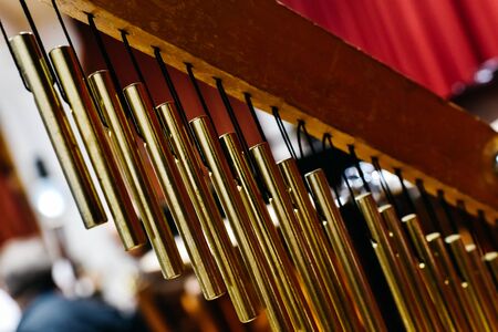 Musical detail of a golden Windchimes.の写真素材