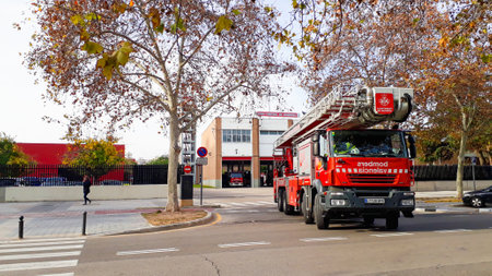 Valencia, Spain - December 18, 2018: Fire truck of Valencia, Spain, leaves the station to work an...