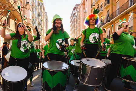 Valencia, Spain - February 16, 2019: Group of strong women belonging to a group of drummers during a...