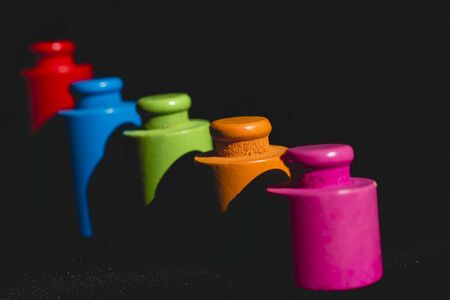 Round pieces of wood colors on black background.の写真素材