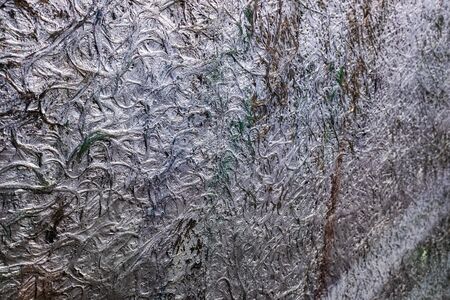 Abstract background of the metallic surface of a conglomerate of painted materials.の写真素材