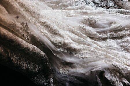 Detail of the texture of a white wedding dress.の写真素材
