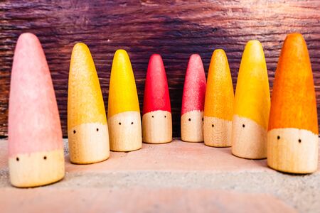 Set of colored wooden conical fish toys for unstructured children's games.