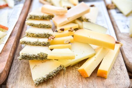 Close-up of a buffet of cheeses of many types.の写真素材