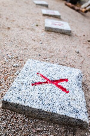 Letter X engraved on the ground to guide doubtful people.の写真素材